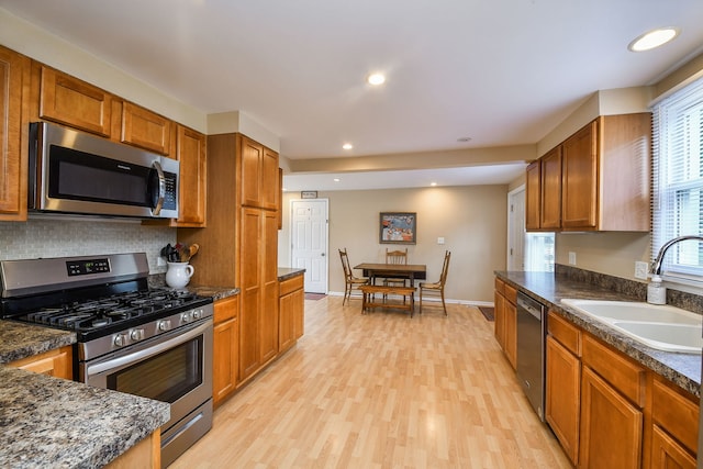 114 Kansas St, Geneva, IL 60134 - kitchen with appliances with stainless steel finishes, light wood-style floors, brown cabinetry, decorative backsplash, and recessed lighting