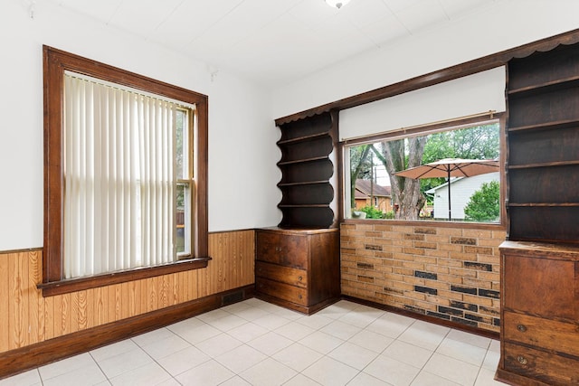 512 Ryerson Ave, Elgin, IL 60123 - empty room featuring a wainscoted wall and wood walls