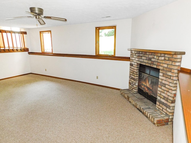 6059 Durrington Dr, Loves Park, IL 61111 - unfurnished living room featuring a brick fireplace, carpet, and ceiling fan