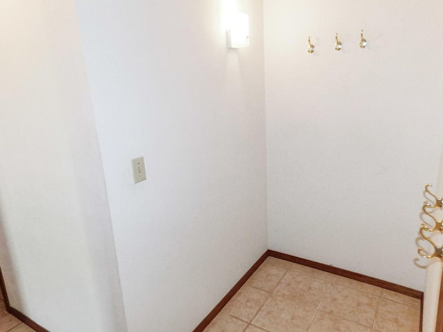 6059 Durrington Dr, Loves Park, IL 61111 - washroom featuring baseboards and light tile patterned floors