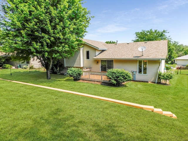 6059 Durrington Dr, Loves Park, IL 61111 - rear view of property featuring a lawn and a shingled roof