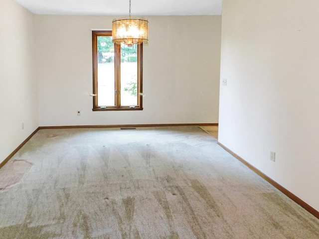 6059 Durrington Dr, Loves Park, IL 61111 - unfurnished room with a chandelier and carpet