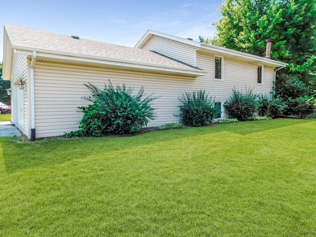 6059 Durrington Dr, Loves Park, IL 61111 - view of property exterior with a yard and a shingled roof