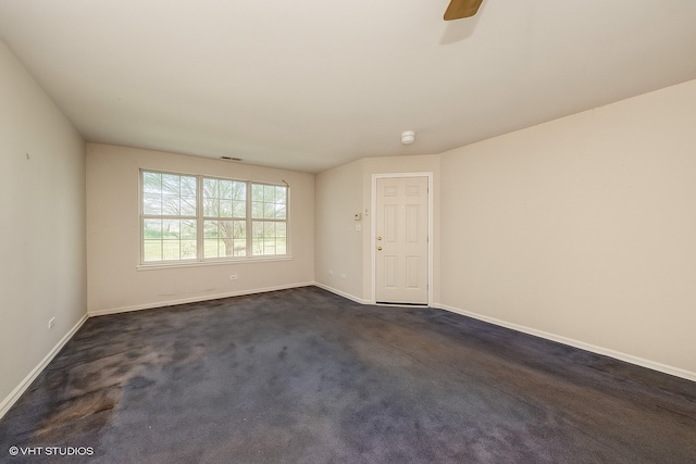 1465 N Larrabee St Unit B, Chicago, IL 60610 - spare room featuring ceiling fan and dark colored carpet