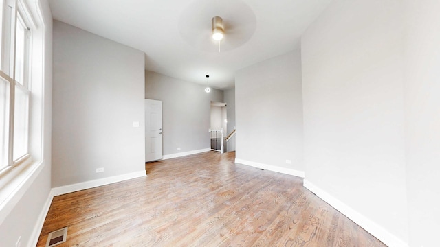 5915 S Sangamon St, Chicago, IL 60621 - empty room with light wood-style floors and a ceiling fan