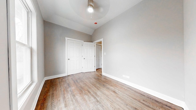 5915 S Sangamon St, Chicago, IL 60621 - unfurnished bedroom featuring wood finished floors, a closet, vaulted ceiling, and a ceiling fan