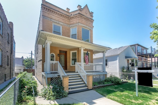 3029 N Haussen Ct, Chicago, IL 60618 - townhome / multi-family property with a porch, stairway, and brick siding