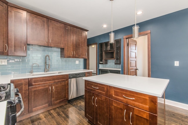 3029 N Haussen Ct, Chicago, IL 60618 - kitchen featuring appliances with stainless steel finishes, dark wood-style flooring, tasteful backsplash, light countertops, and recessed lighting