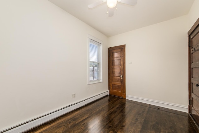 3029 N Haussen Ct, Chicago, IL 60618 - spare room featuring baseboard heating, dark wood-style flooring, and a ceiling fan