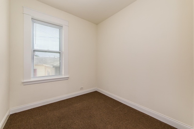 3029 N Haussen Ct, Chicago, IL 60618 - spare room featuring dark colored carpet and baseboards