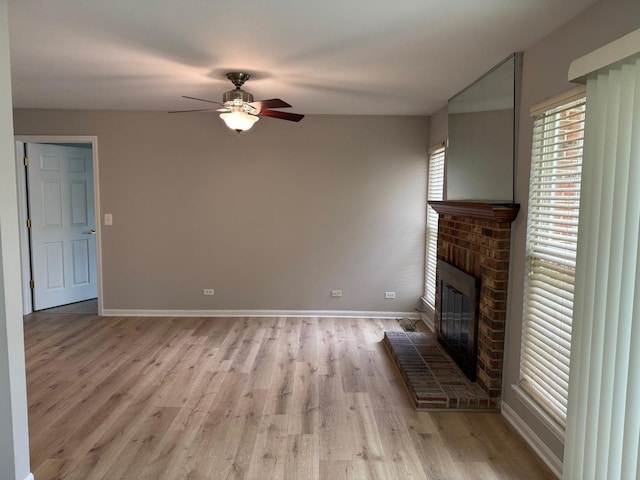 36138 N Springbrook Ln Unit 36138, Gurnee, IL 60031 - unfurnished living room with a ceiling fan, light wood finished floors, and a fireplace