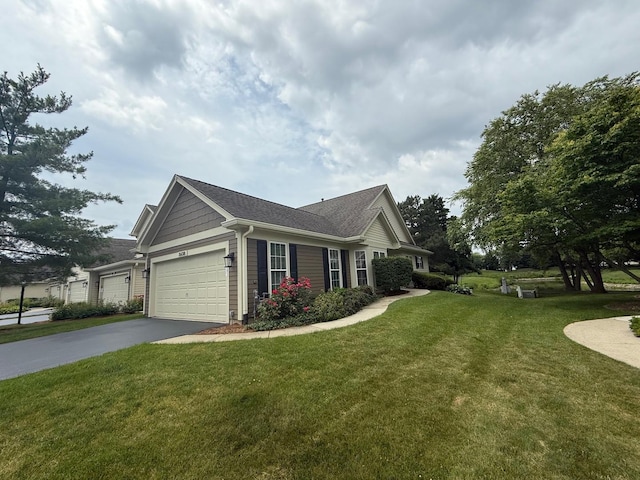 36138 N Springbrook Ln Unit 36138, Gurnee, IL 60031 - view of property exterior with driveway, a lawn, an attached garage, and a shingled roof