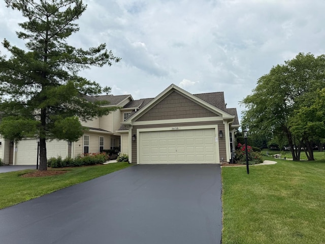 36138 N Springbrook Ln Unit 36138, Gurnee, IL 60031 - view of front of property featuring driveway, a front lawn, and an attached garage