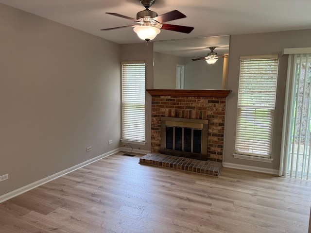 36138 N Springbrook Ln Unit 36138, Gurnee, IL 60031 - unfurnished living room featuring ceiling fan, wood finished floors, and healthy amount of natural light