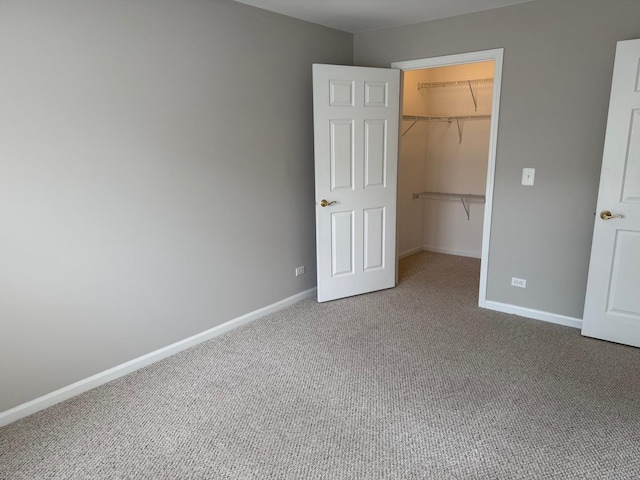 36138 N Springbrook Ln Unit 36138, Gurnee, IL 60031 - unfurnished bedroom with a spacious closet, carpet floors, and a closet