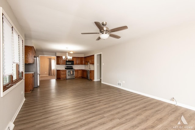 8226 Bob O Link Rd, Orland Park, IL 60462 - unfurnished living room featuring a chandelier, dark wood-style flooring, a ceiling fan, and a baseboard radiator