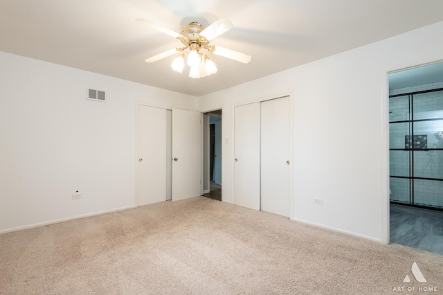 8226 Bob O Link Rd, Orland Park, IL 60462 - unfurnished bedroom with carpet, two closets, connected bathroom, and ceiling fan