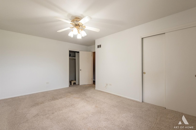 8226 Bob O Link Rd, Orland Park, IL 60462 - unfurnished bedroom with multiple closets, carpet floors, and a ceiling fan