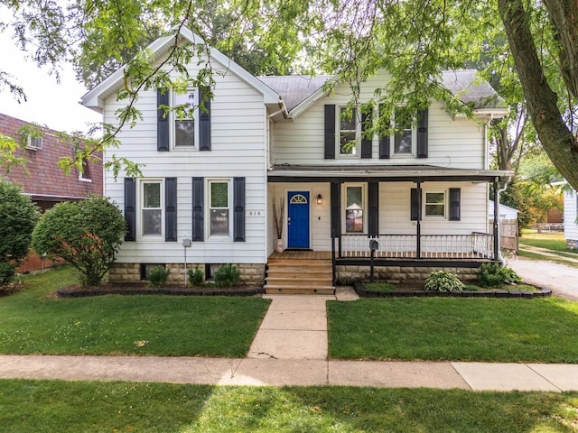 616 N Main St, Pontiac, IL 61764 - view of front of house with a porch and a front lawn