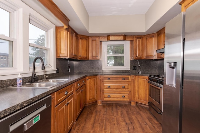 616 N Main St, Pontiac, IL 61764 - kitchen with stainless steel appliances, dark wood finished floors, and brown cabinets