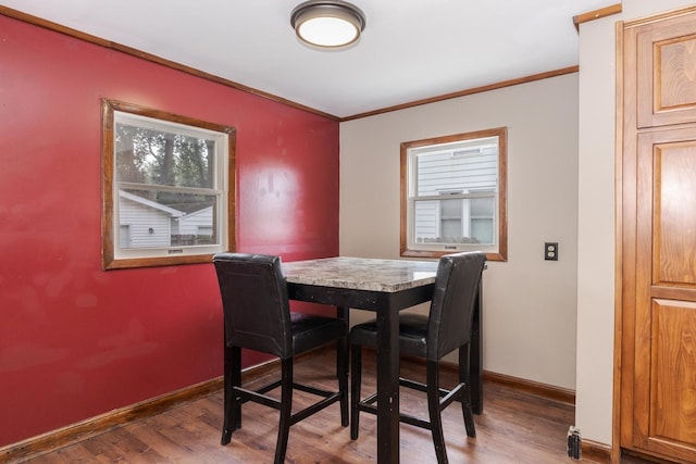 616 N Main St, Pontiac, IL 61764 - dining space featuring wood finished floors and ornamental molding