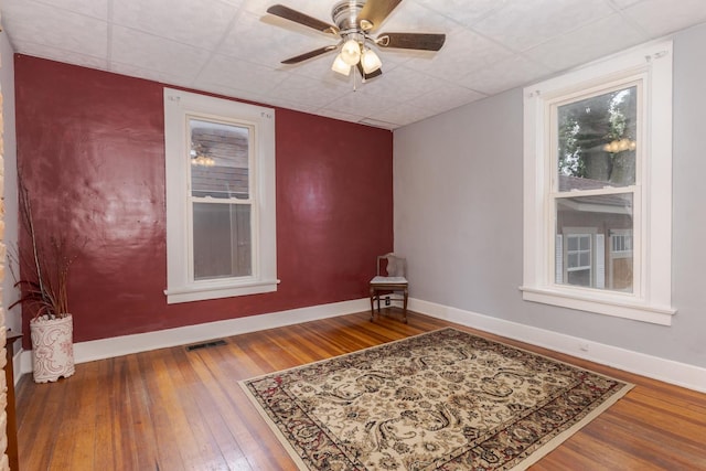 616 N Main St, Pontiac, IL 61764 - unfurnished room with hardwood / wood-style floors, ceiling fan, and a paneled ceiling