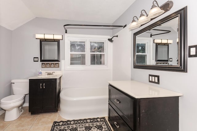 616 N Main St, Pontiac, IL 61764 - bathroom featuring lofted ceiling, tile patterned floors, and vanity