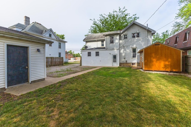 616 N Main St, Pontiac, IL 61764 - rear view of property featuring a shed