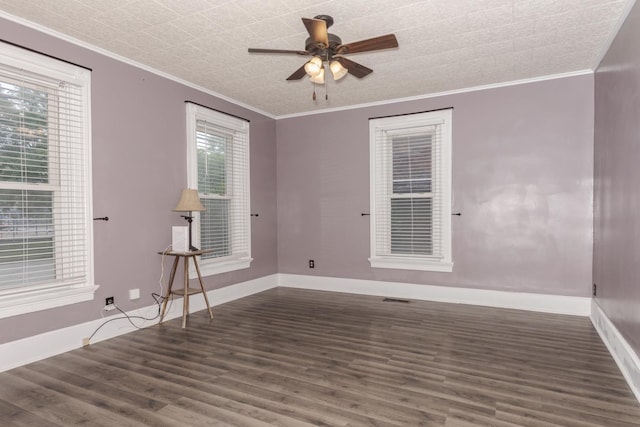 616 N Main St, Pontiac, IL 61764 - empty room with crown molding, dark wood-style floors, and a ceiling fan