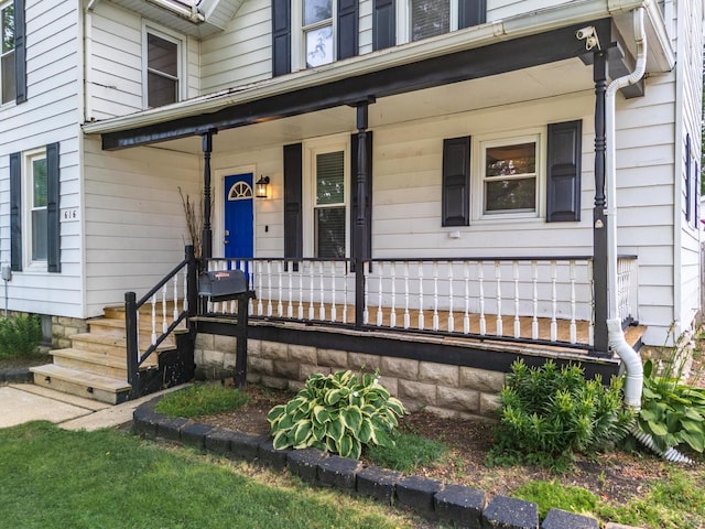 616 N Main St, Pontiac, IL 61764 - doorway to property featuring covered porch