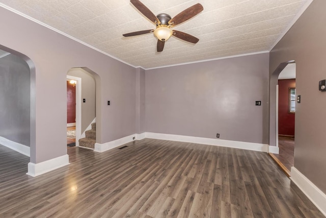 616 N Main St, Pontiac, IL 61764 - empty room with ornamental molding, ceiling fan, wood finished floors, and stairs