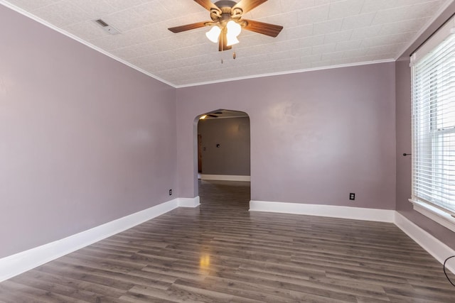 616 N Main St, Pontiac, IL 61764 - spare room with arched walkways, ornamental molding, ceiling fan, healthy amount of natural light, and dark wood-style floors