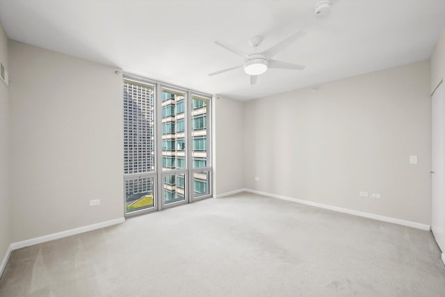 125 S Jefferson St Unit 1702, Chicago, IL 60661 - carpeted spare room with ceiling fan and expansive windows