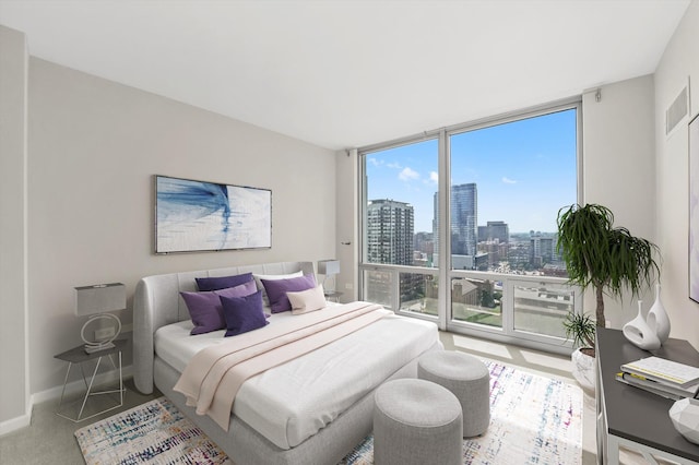 125 S Jefferson St Unit 1702, Chicago, IL 60661 - bedroom with floor to ceiling windows, a city view, and carpet
