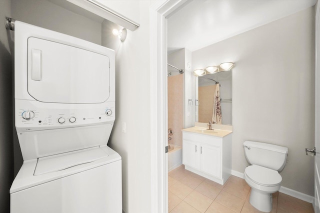 125 S Jefferson St Unit 1702, Chicago, IL 60661 - washroom featuring estacked washer and dryer and light tile patterned flooring