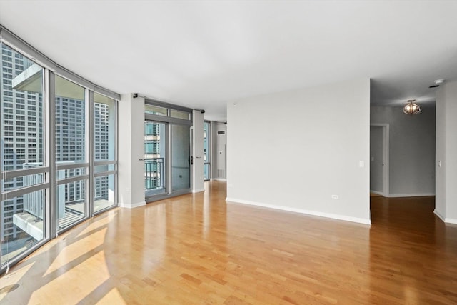 125 S Jefferson St Unit 1702, Chicago, IL 60661 - empty room featuring light wood finished floors and floor to ceiling windows