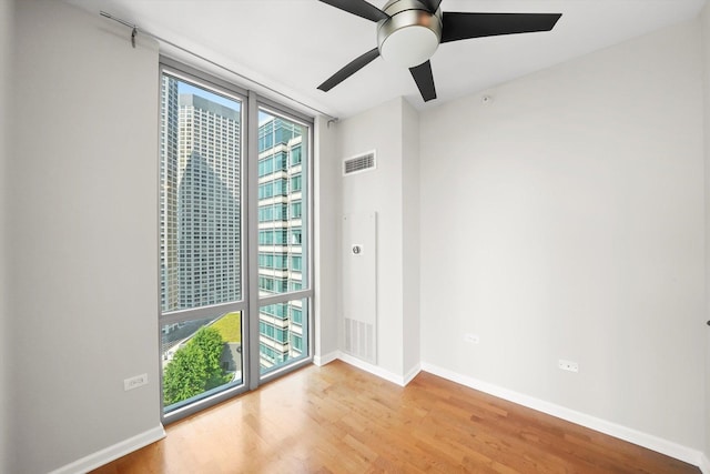 125 S Jefferson St Unit 1702, Chicago, IL 60661 - unfurnished room with light wood-type flooring, a ceiling fan, and a heating unit