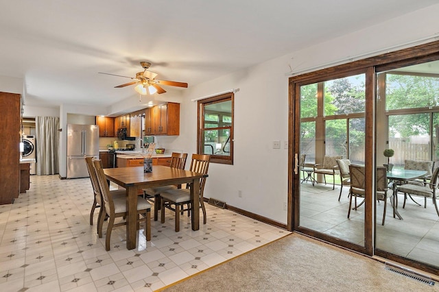 1622 Pickwick Ln, Dekalb, IL 60115 - dining space featuring washer / dryer, plenty of natural light, ceiling fan, and light flooring