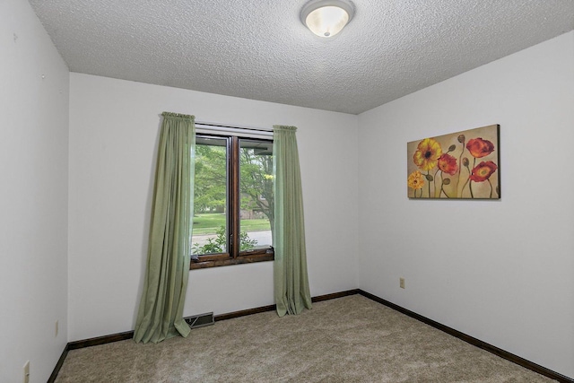 1622 Pickwick Ln, Dekalb, IL 60115 - carpeted empty room with a textured ceiling and baseboards