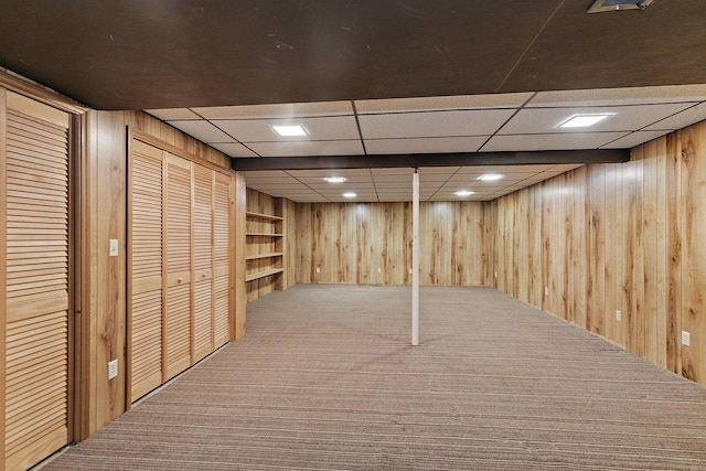 1622 Pickwick Ln, Dekalb, IL 60115 - finished below grade area with carpet, wood walls, and a paneled ceiling