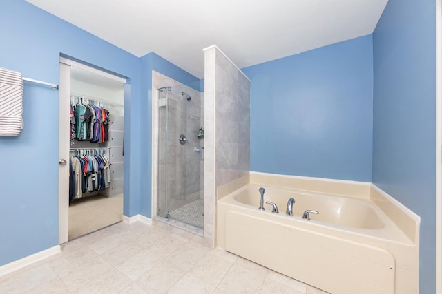 1905 Oxley Cir, Naperville, IL 60563 - bathroom with a garden tub, a stall shower, tile patterned floors, and a spacious closet