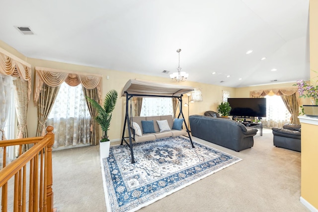 1905 Oxley Cir, Naperville, IL 60563 - living area with carpet, a chandelier, plenty of natural light, arched walkways, and lofted ceiling