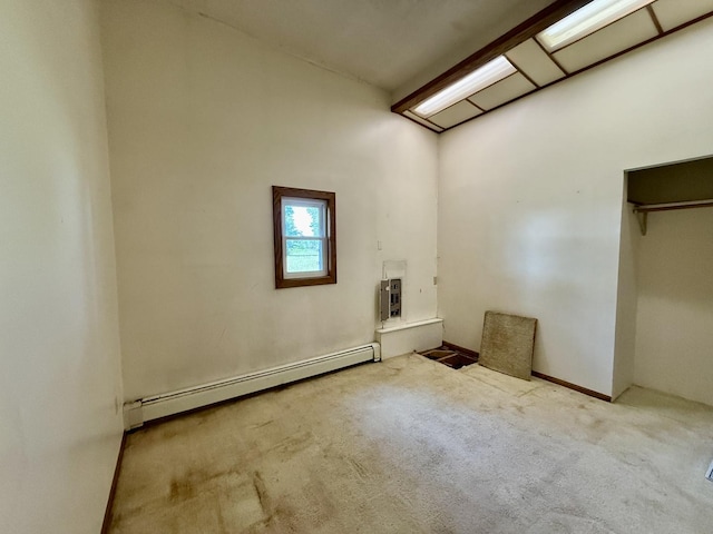 214 S Rising Rd, Champaign, IL 61822 - unfurnished bedroom featuring baseboard heating and carpet floors