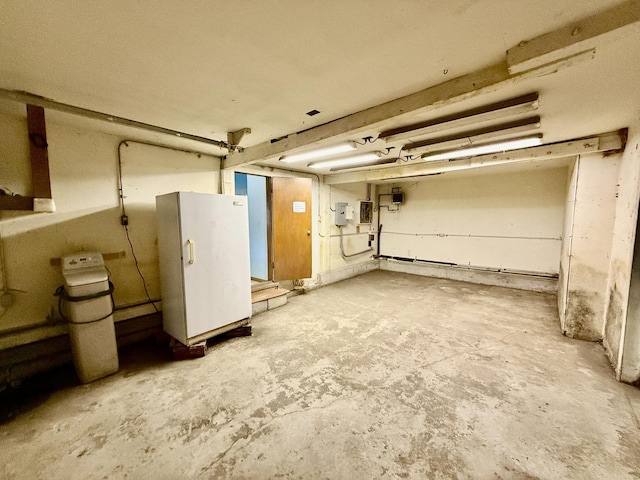 214 S Rising Rd, Champaign, IL 61822 - unfinished basement featuring freestanding refrigerator, a water softener system, and electric panel