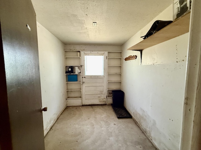 214 S Rising Rd, Champaign, IL 61822 - misc room featuring unfinished concrete flooring and a textured ceiling