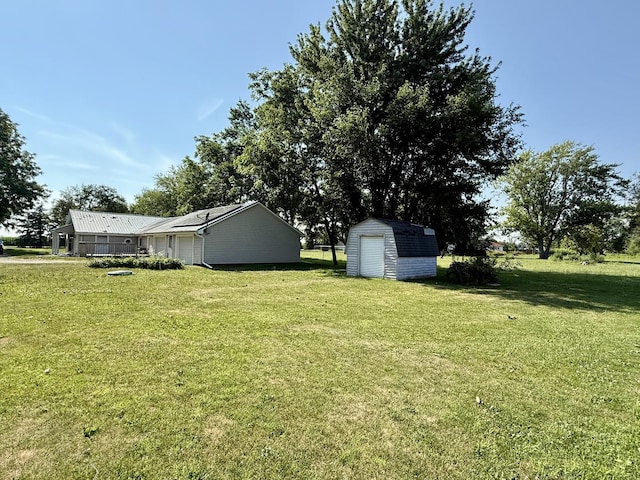 214 S Rising Rd, Champaign, IL 61822 - view of green lawn with a storage unit