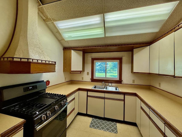 214 S Rising Rd, Champaign, IL 61822 - kitchen with gas range oven, light countertops, and white cabinets