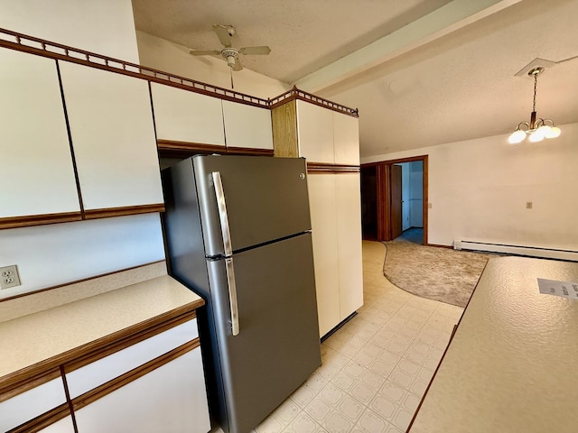 214 S Rising Rd, Champaign, IL 61822 - kitchen with freestanding refrigerator, a baseboard heating unit, a ceiling fan, white cabinets, and decorative light fixtures