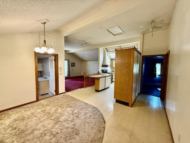 214 S Rising Rd, Champaign, IL 61822 - kitchen featuring gas range oven, a ceiling fan, pendant lighting, and baseboard heating