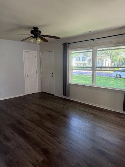 324 Elmwood Ln, Antioch, IL 60002 - unfurnished living room featuring dark wood-style floors and ceiling fan